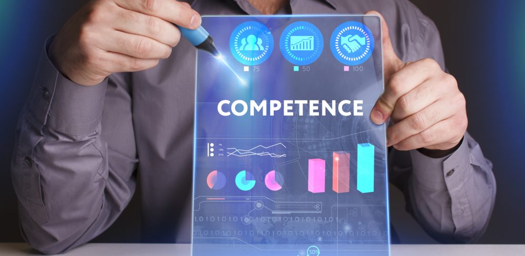 Business, Technology, Internet and network concept. Young businessman working on a virtual screen of the future and sees the inscription: Competence Business, Technology, Internet and network concept. Young businessman working on a virtual screen of the future and sees the inscription: Competence